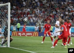 England's Harry Kane scores during the group G match between Tunisia and England at the 2018 soccer World Cup in the Volgograd Arena in Volgograd, Russia, Monday, June 18, 2018.