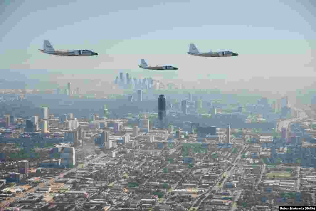 NASA's three WB-57s, High Altitude Research aircraft fly over foggy downtown Houston, Texas, during their historic formation flight over the area on Nov. 19, 2015. It was the first time that all three WB-57s have been aloft simultaneously since the early 1970s, when the U.S. Air Force had an operational squadron of WB-57s.