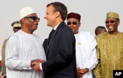  In this photo taken on July 2, 2018, French President Emmanuel Macron delivers a speech at a press conference before a G5 Sahel meeting (from left to right) Abdel Aziz, President of Niger Mahamadou Issoufou, President of Mali Ibrahim Boubacar Keita, President of Chad Idriss Deby, President of Burkina Faso Roch Marc Christian Kabore, in Nouakchott, Mauritania 