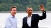 奥巴马总统6月17日抵达在北爱尔兰举行的G8峰会场地，英国首相卡梅伦欢迎的他的到来。（照片来源：路透社）