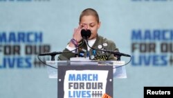 Emma Gonzalez, a student and shooting survivor from the Marjory Stoneman Douglas High School in Parkland, Florida, cries as she addresses the conclusion of the "March for Our Lives" event demanding gun control at a rally in Washington, March 24, 2018.