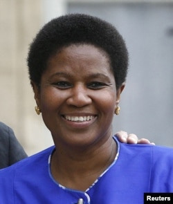 FILE - Phumzile Mlambo-Ngcuka, head of UN Women, points up gaps and gains in gender equality.