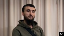 FILE - Tumso Abdurakhmanov, the 32-year-old Chechen video blogger, is photographed during an interview with The Associated Press somewhere in Poland, Nov. 14, 2018. 