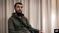 FILE - Tumso Abdurakhmanov, the 32-year-old Chechen video blogger, is photographed during an interview with The Associated Press somewhere in Poland, Nov. 14, 2018. 