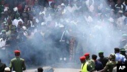 A Nigerian soldier lies on the ground after a small blast was heard in the midst of 50th anniversary celebrations of Nigeria's independence at Eagle Square in Abuja, Nigeria, 01 Oct 2010