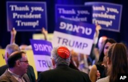 FILE - An attendee wears a "Make America Great Again" yarmulke before President Donald Trump speaks at an annual meeting of the Republican Jewish Coalition, April 6, 2019, in Las Vegas, Nevada.