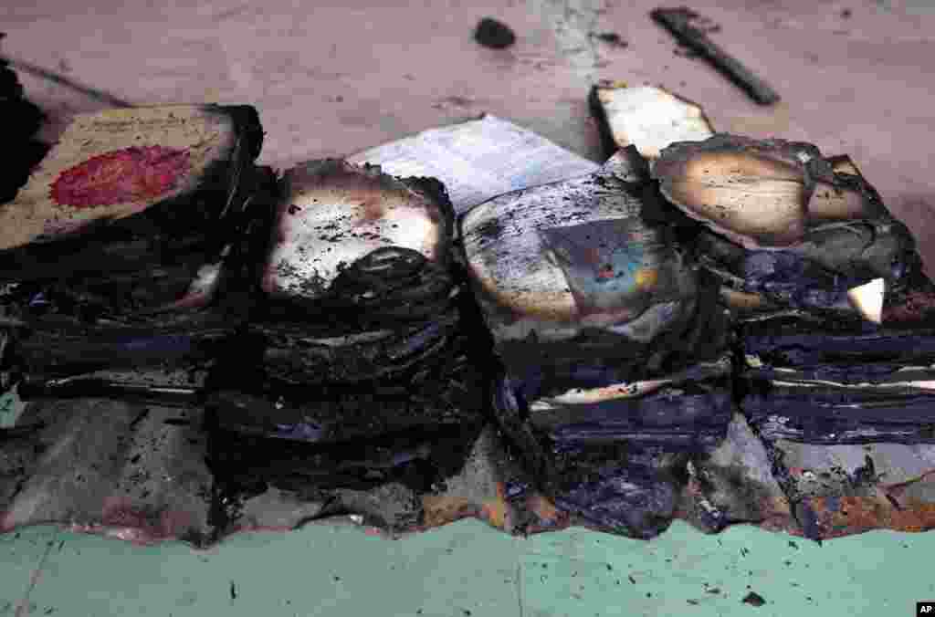 The remains of burned religious books at a Buddhist temple that was torched in an overnight attack in Ramu in the coastal district of Cox's Bazar, Bangladesh, October 1, 2012.