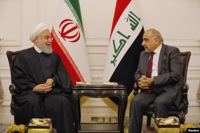 Iraq's Prime Minister Adel Abdul Mahdi meets Iranian President Hassan Rouhani in Baghdad, Iraq, March 11, 2019.