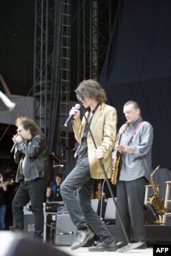 FILE - Magic Dick, Peter Wolf and J. Geils of the J. Geils Band perform at Fenway Park in Boston, Aug. 14, 2010.