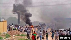 People take part in protests over fuel subsidy cuts in Khartoum September 25, 2013. At least 27 people have been killed in protests in Khartoum over fuel subsidy cuts, a medical source said on Thursday as another bout of the worst unrest seen in Sudan's r