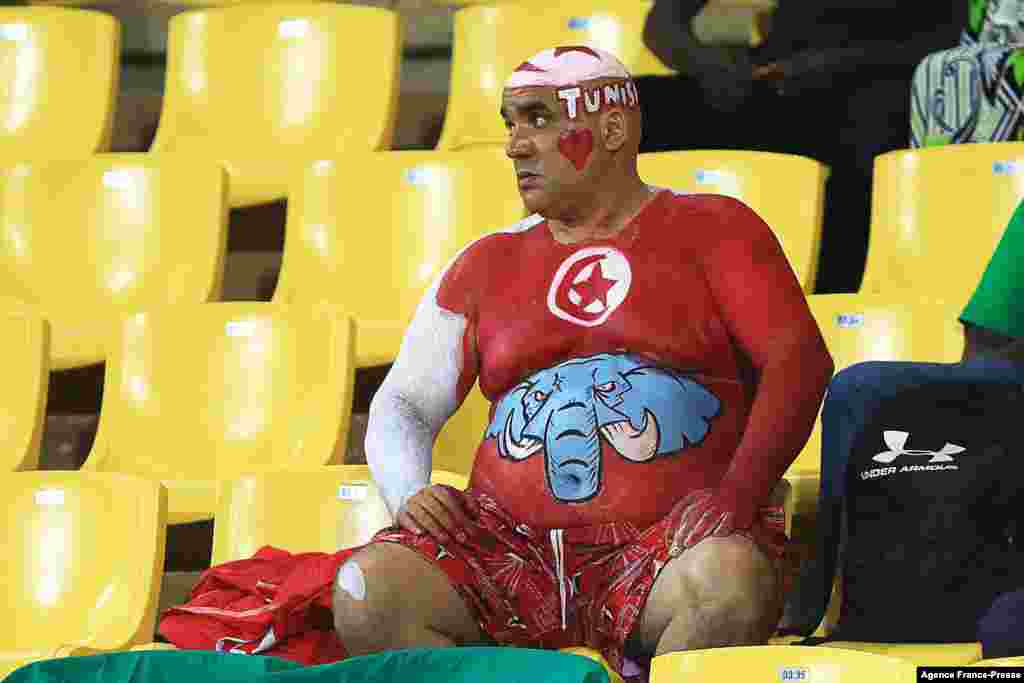 A Tunisian supporter poses prior to the round of 16 football match between Nigeria and Tunisia in Garoua, Cameroon on Jan. 23, 2022.