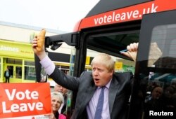 Former London Mayor Boris Johnson holds up a Cornish pasty during the launch of the Vote Leave bus campaign, in favor of Britain's exit from the European Union, in Truro, England, May 11, 2016.