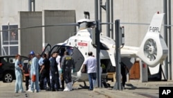 Rescue services evacuate an injured person after an explosion at the Marcoule nuclear waste treatment site killed one person and injured four, southern France, September 12, 2011.