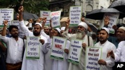 Activists of All Bengal Minority Youth Federation shout slogans as they protest against the final draft of the National Register of Citizens (NRC) in the northeastern state of Assam, in Kolkata, India, July 31, 2018.