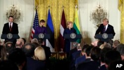 President Donald Trump speaks during a news conference with, from left, Latvian President Raimonds Vejonis, Estonian President Kersti Kaljulaid, and Lithuanian President Dalia Grybauskaite in the East Room of the White House, April 3, 2018, in Washington.