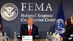 President Donald Trump meets with emergency officials to discuss the upcoming hurricane season, at Federal Emergency Management Agency (FEMA) headquarters in Washington, Aug. 4, 2017.