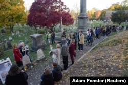 People line up to visit the grave of women's suffrage leader Susan B. Anthony on U.S. election day at Mount Hope Cemetery in Rochester, New York November 8, 2016.