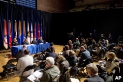 Reporters interview officials on the inaugural preparations being made by the Joint Task Force-National Capital Region for military and civilian planners at the D.C. Armory in Washington, Dec. 14, 2016.