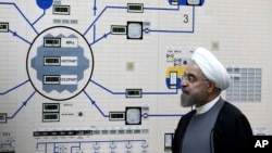 FILE - President Hassan Rouhani visits the Bushehr nuclear power plant just outside the port city of Bushehr, Iran, Jan. 13, 2015, in this photo released by the Iranian Presidency Office.