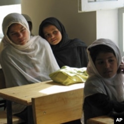 Afghan girls attend their first day of class at a school in the village of Deh Hassan.