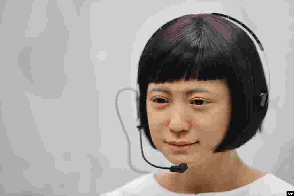 A robot produced by Japan's Hiroshi Ishiguro Laboratories called 'Kodomoroid' Japan 2014 is on view at the ROBOT exhibition at the Science Museum in London.