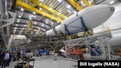 The Falcon 9 rocket and DART spacecraft readied for launch are seen at the SpaceX hanger, Vandenberg Space Force Base in California, Nov. 22, 2021. 