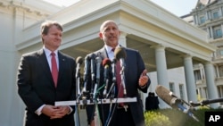 Goldman Sachs Group, Inc., Chairman and CEO Lloyd Blankfein, right, accompanied by Bank of America CEO Brian Moynihan, speaks to reporters outside the White House in Washington on Oct. 2, 2013, after they and other financial leaders met with President Barack Obama regarding the debt ceiling and the economy. 