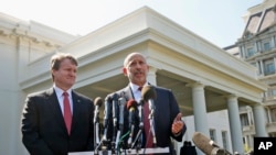 Goldman Sachs Group, Inc., Chairman and CEO Lloyd Blankfein, right, accompanied by Bank of America CEO Brian Moynihan, speaks to reporters outside the White House in Washington, Wednesday, Oct. 2, 2013.