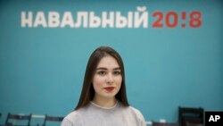 Russian opposition leader Alexei Navalny supporter Ekaterina Osovskaya, 18, poses for a photo in Moscow, Russia, March 2, 2018. Vladimir Putin's legacy depends not only on winning re-election Sunday but also on ensuring that today's first-time voters stay loyal to his vision. Nationwide, young people are among his most ardent supporters, but some twenty-somethings who have only known Putin as their leader are frustrated by income equality, corruption and other problems under his all-powerful leadership.