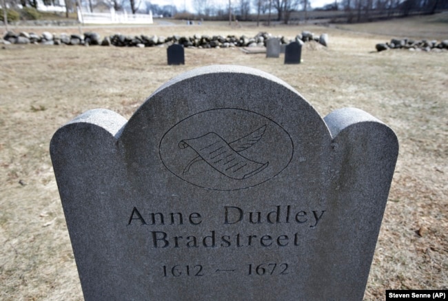This Tuesday, March 19, 2019, photo, shows a commemorative marker for 17th century American poet Anne Bradstreet at an old burial ground, in North Andover, Massachusetts.