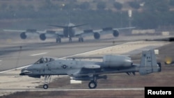 FILE - A U.S. Air Force A-10 Thunderbolt II fighter jet lands at Incirlik airbase in the southern city of Adana, Turkey.