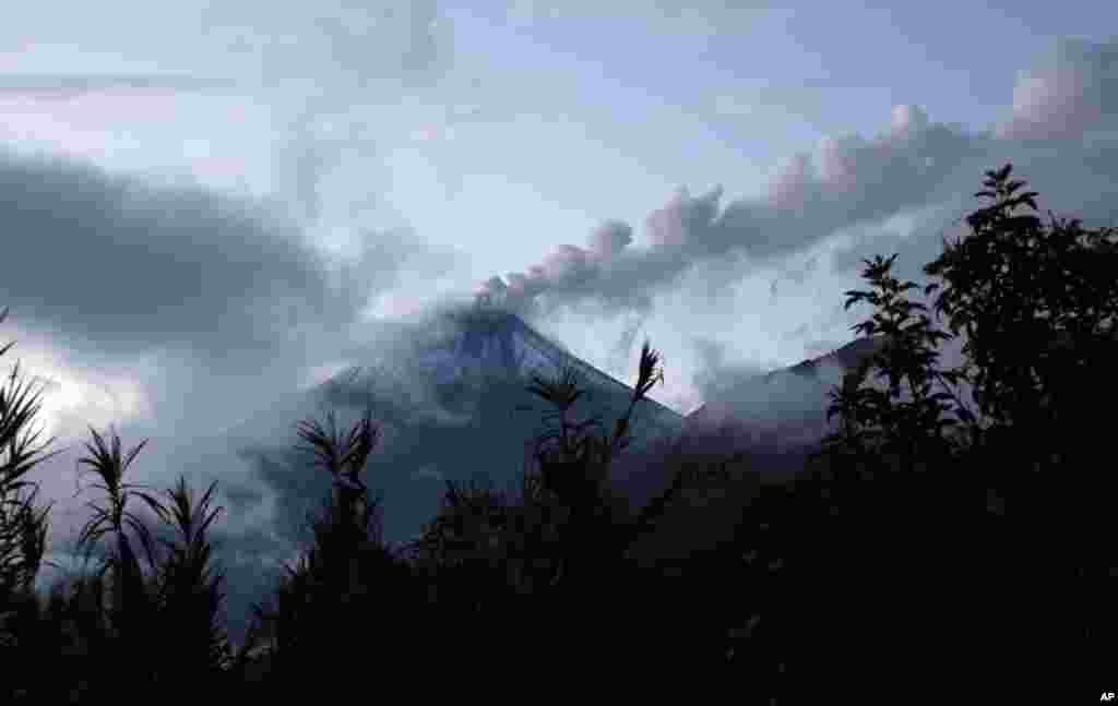 The Tungurahua volcano blows steam and ash, seen from Guadalupe, Ecuador