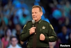 FILE - Broward County Sheriff Scott Israel speaks before the start of a CNN town hall meeting in Sunrise, Florida, Feb. 21, 2018.