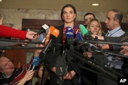 Former Russian pole vaulter Yelena Isinbayeva speaks to the media in Moscow, Russia, Dec. 9, 2016.