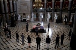 Capitol Hill staff members pay their respects to Justice Ruth Bader Ginsburg.