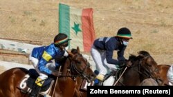 Fallou Diop competing in a weekly race by the Hippodrome Ndiaw Macodou DIOP in Thies, Senegal, February 7, 2021. (REUTERS/Zohra Bensemra)
