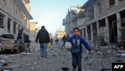 Zarokek li Îdlibê, piştî êrîşeke esmanî