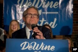 Ohio Attorney General and Republican gubernatorial candidate Mike DeWine addresses supporters after winning the primary election, May 8, 2018, in Columbus.