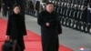 North Korean leader Kim Jong Un and wife Ri Sol Ju inspect an honor guard before leaving Pyongyang for a visit to China, in this Jan. 7, 2019 photo released by North Korea's Korean Central News Agency (KCNA) in Pyongyang, Jan. 8, 2019. 