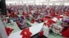 Hit by Pandemic, A Handful of Garment Factories Switch to Mask Production 