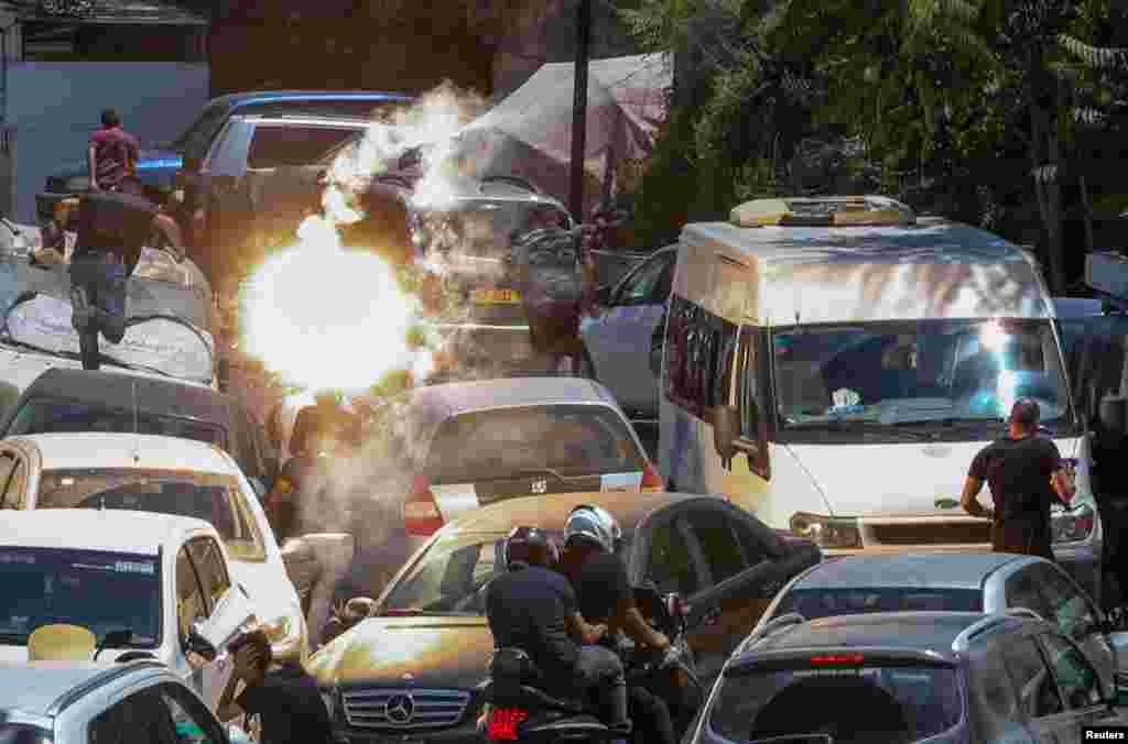 People run after Israeli security forces fired tear gas canisters during clashes with Palestinians following Friday prayers amid tension over expected home demolitions in the Silwan neighborhood in East Jerusalem.