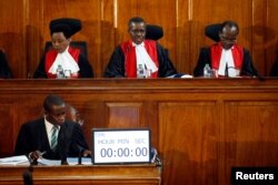 FILE - Kenya's Supreme Court judges attend a hearing regarding petitions challenging the result of the presidential election re-run at Kenya's Supreme Court in Nairobi, Nov. 14, 2017.