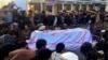 FILE - Pakistanis attend a funeral service for the victims of a bomb blast at a mosque in Parachinar, the capital of Pakistan's northwestern Kurram tribal region, Jan. 21, 2017. 