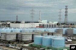 n this Oct. 12, 2017, photo, ever-growing amount of contaminated, treated but still slightly radioactive, water at the wrecked Fukushima Dai-ichi nuclear plant is stored in about 900 huge tanks