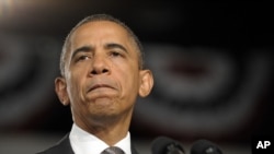 President Barack Obama pauses as he speaks about the Aurora, Colorado shooting at a campaign event in Ft. Myers, Florida, July 20, 2012.