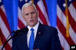FILE - Vice President-elect Mike Pence addressed the press before introducing President-elect Donald Trump in New York, Jan. 11, 2017.