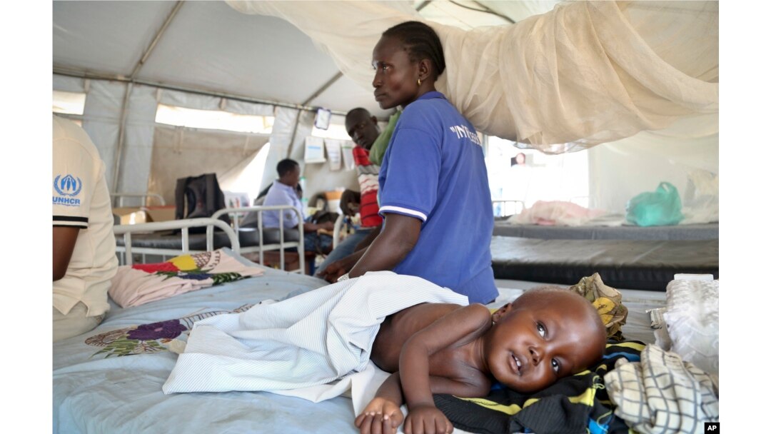 Two-year-old South Sudanese refugee Simon is accompanied by his grandmother as he is treated for malnutrition in Bidi Bidi camp, northern Uganda, March 15, 2017.