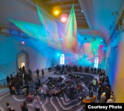 Janet Echelman’s net sculpture represents the tsunami that hit Japan in 2011. (Credit: Bruce Petschek)