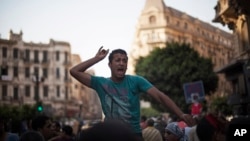 An Egyptian man chants slogans against Egyptian President Mohammed Morsi during a spontaneous anti-Muslim Brotherhood demonstration near Tahrir Square, in downtown Cairo, Egypt, June 21, 2013.