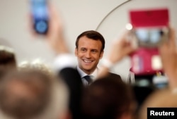 French President Emmanuel Macron arrives for the annual May Day ceremony at the Elysee Palace, in Paris, France, May 1, 2019.